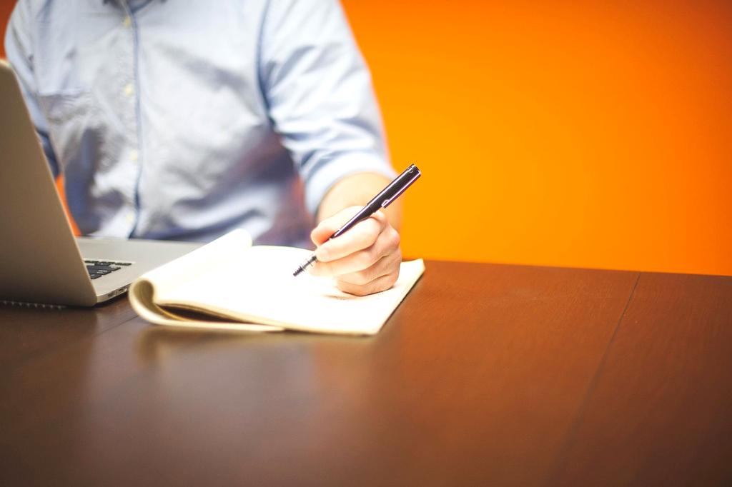 Content writer brainstorming ideas in a notebook