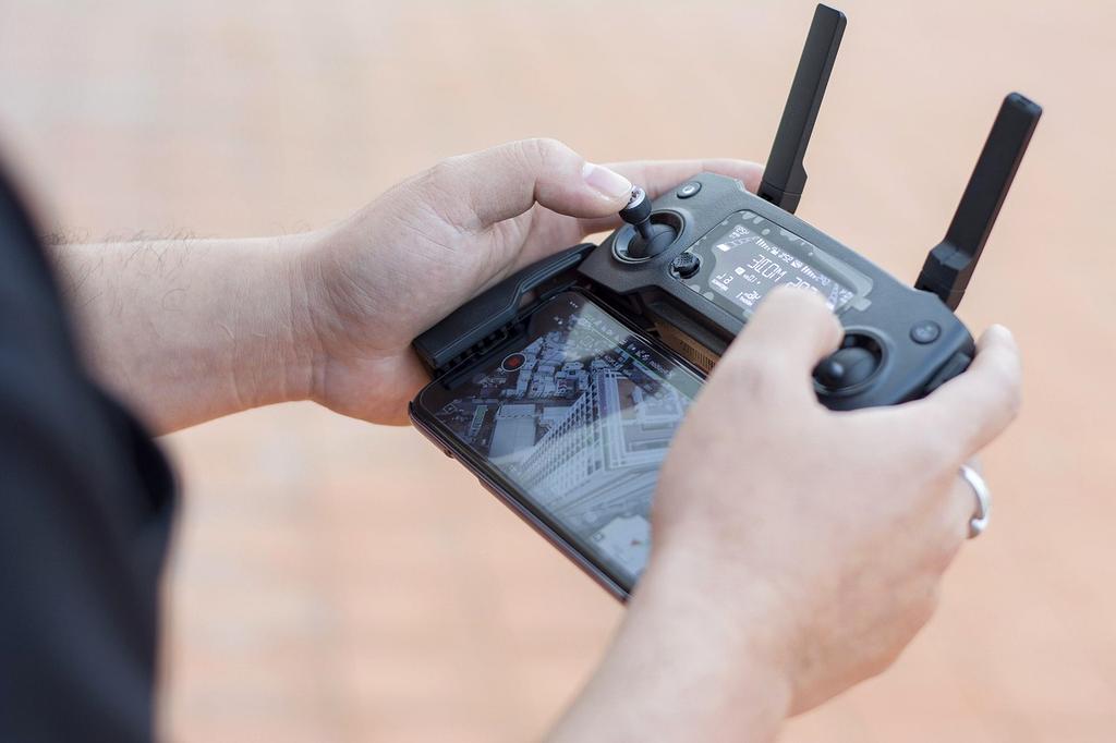 Filmmaker adjusting a camera lens in a studio